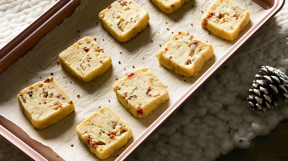 Bacon, Maple and cheddar shortbread squares on pan.
