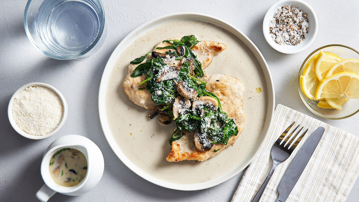 Chicken breast topped with sautéed spinach 