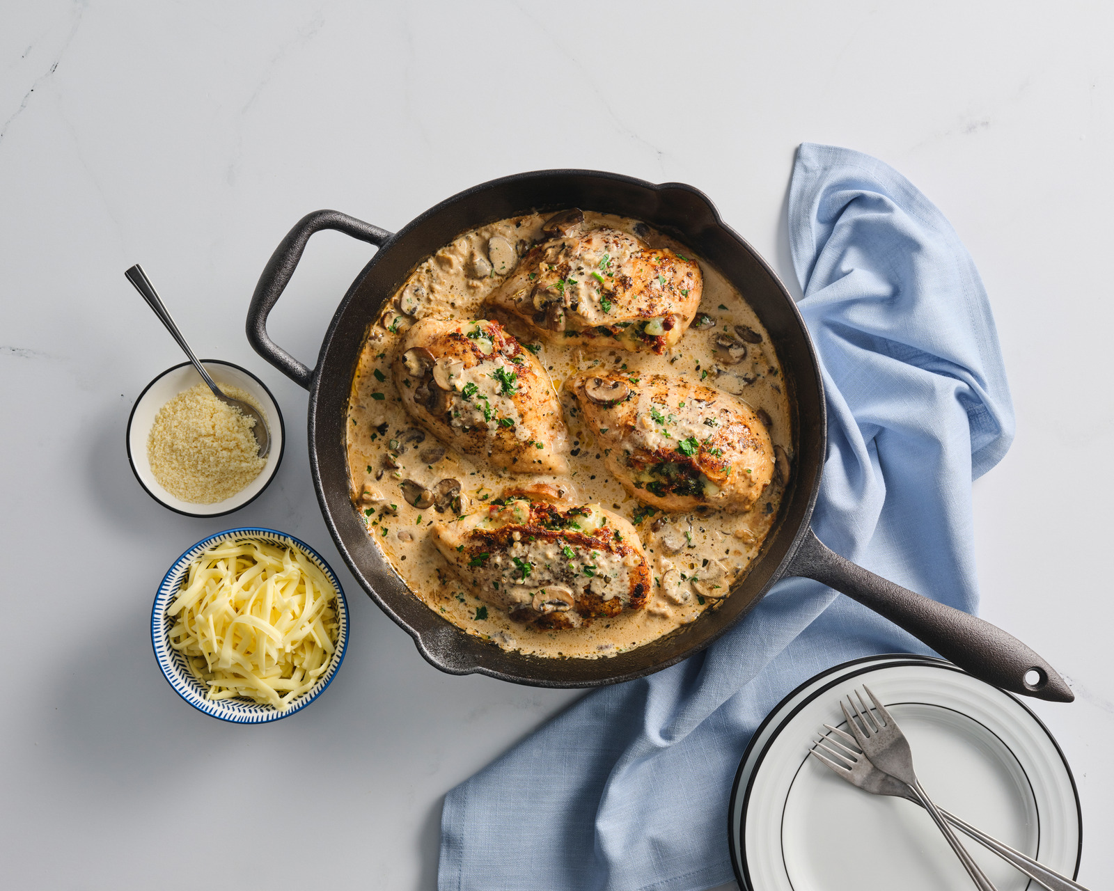 skillet of chicken in a cream sauce from overhead