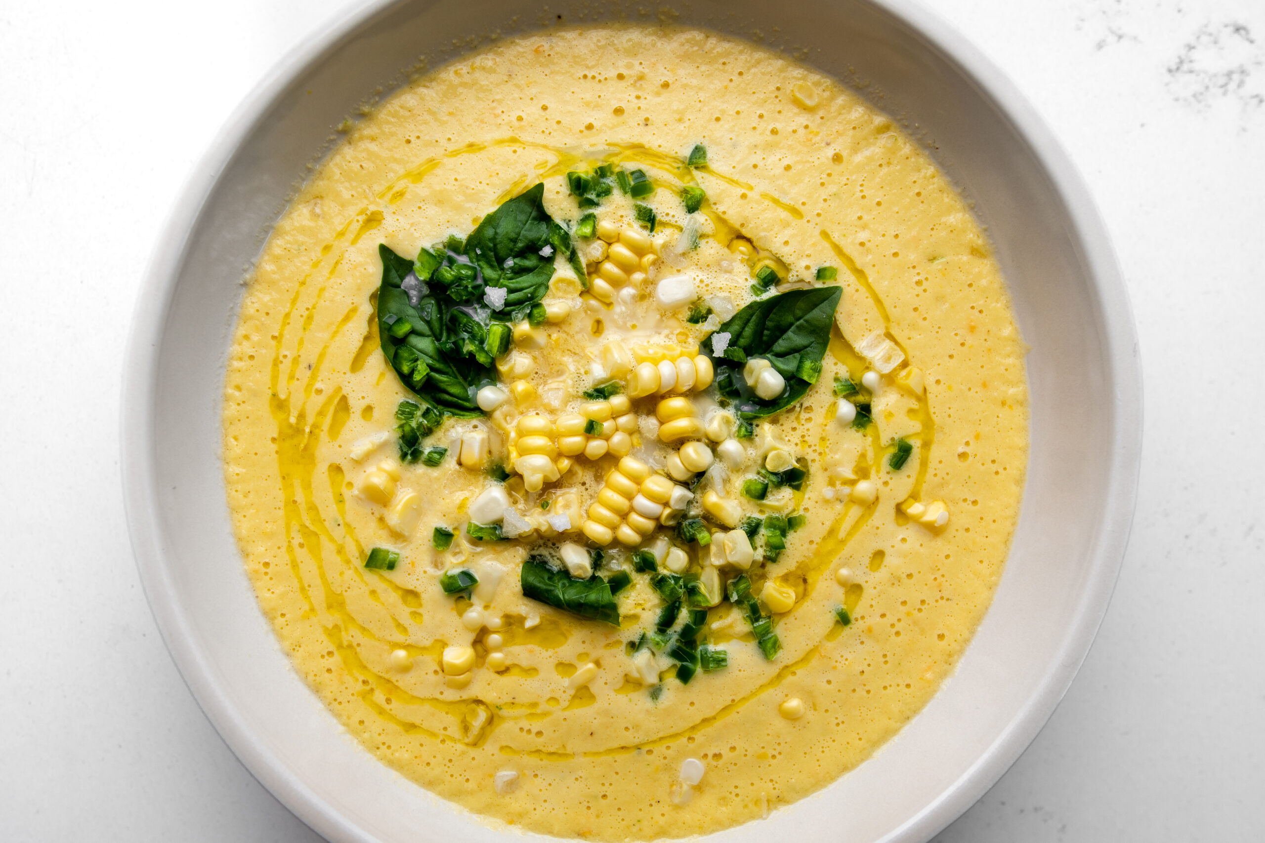 bowl of creamy corn summer gazpacho